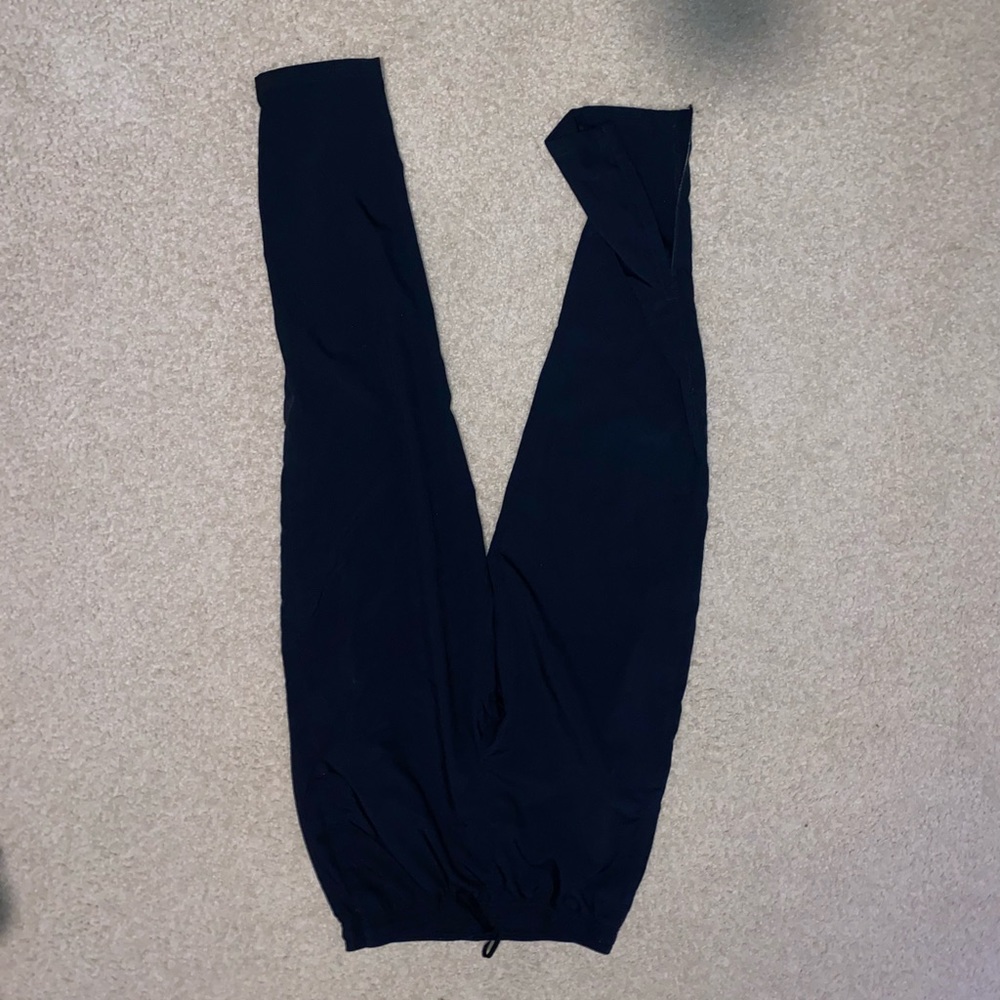 Nike Tech pants with zipper at the ankle